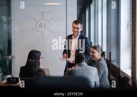 Diverse business team in a modern office during a meeting, discussing artificial intelligence strategy. Concept of AI innovation, teamwork, leadership Stock Photo