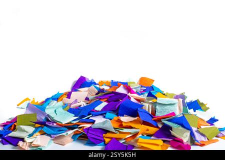 Collection of vibrant crepe paper pieces in an assortment of bright colors on a white background. suitable for creative, decorative, or educational pu Stock Photo