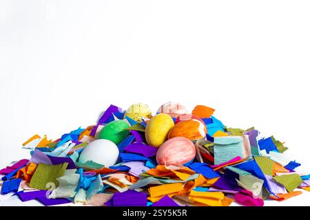 Festive Easter eggs painted in vibrant colors of colorful paper decorations exude celebration and joy. Stock Photo