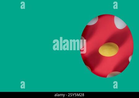Easter greeting card. Paper cut egg, white egg surrounding yellow egg on red background, cope space for text. Stock Photo