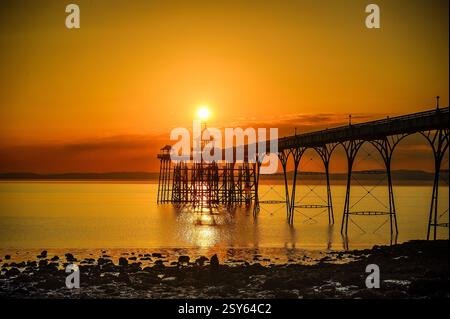 A beautiful sunset over the pier at Clevedon in the United Kingdom. The band One Direction filmed a video here. Stock Photo