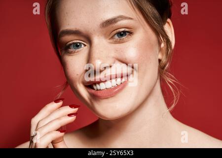 A young woman beams with style and trendy nails against a striking backdrop. Stock Photo