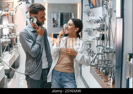 Woman and man is in the store of goods for the home. Stock Photo