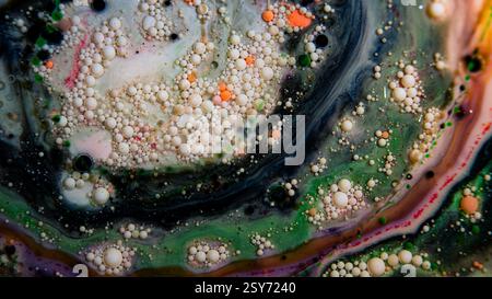 Abstract macro picture of paint mixed with oil to create an artistic textured background that looks like a rock or geode Stock Photo