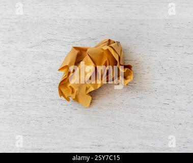 Piece of crumpled yellow note paper Stock Photo