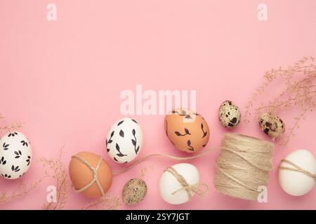 Composition with Easter eggs on pink background. Space for text Stock Photo