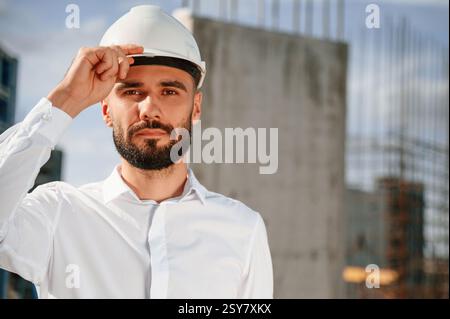 Portrait of man that is in uniform on the construction site. Stock Photo
