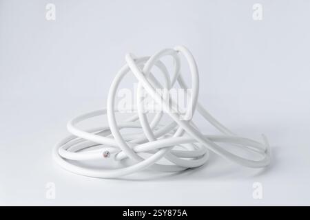 Tangled insulated electrical wire isolated on white Stock Photo