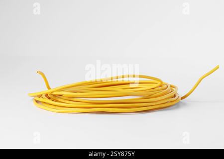 Insulated yellow electrical wire isolated on white Stock Photo