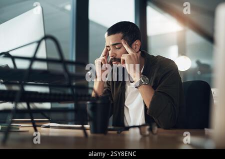 Computer, design and stress with man in office at night for website coding or programming deadline. Business, desktop and headache with annoyed Stock Photo