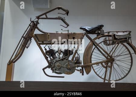 Vintage motorcycle concept showcases engineering history with intricate details in a modern exhibit setting Stock Photo