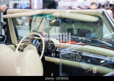 Classic convertible interior showcases timeless elegance and vintage charm at an auto show, inviting nostalgic appreciation from car enthusiasts Stock Photo