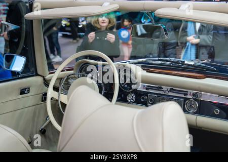 Classic convertible interior showcases timeless design at an auto show, capturing the essence of elegance and nostalgia Stock Photo