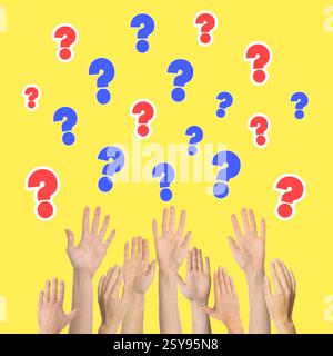 People raising hands and question marks on yellow background, closeup Stock Photo