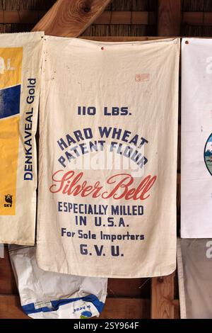 A historic flour sack labeled "Silver Bell," featuring bold typography, hangs in Concordia corn mill in Ede, Netherlands, highlighting milling heritag Stock Photo
