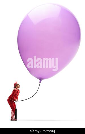 Entertainer pumping a big purple balloon isolated on white background Stock Photo