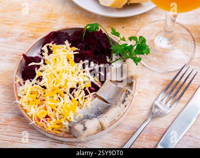 Beetroot served with cheese and pickled mackerel Stock Photo
