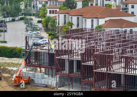 Development of real estate market in the USA. Large construction site with workers and building equipment in Fort Myers, Florida Stock Photo