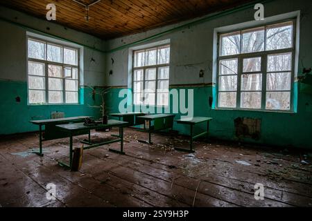 Ruined classroom in abandoned school. Stock Photo
