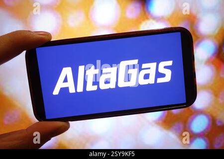 In this photo illustration, the AltaGas logo is displayed on a ...