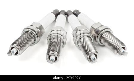 Four iridium spark plugs in a row isolated on white background with clipping path Stock Photo