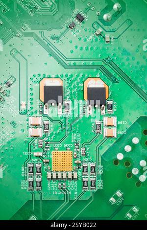 Detailed close up of a green circuit board showcasing chips electronic components and pathways. Ideal for technology and electronics related themes, h Stock Photo