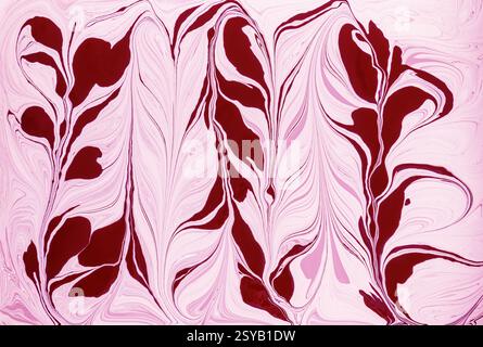 A stunning floral design featuring flowing abstract shapes in shades of red and pink acrylic paint. The swirls create a dynamic sense of movement and Stock Photo