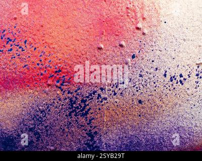 A stunning textured abstract painting with vibrant colors blending seamlessly. The intricate details and gradients of red, purple, and white create a Stock Photo