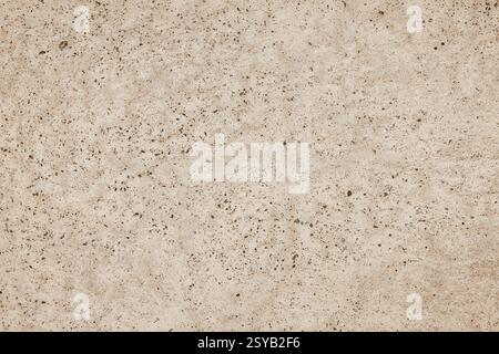 High-quality image of a seamless speckled beige surface, perfect for creating versatile textured backgrounds in design projects. Stock Photo