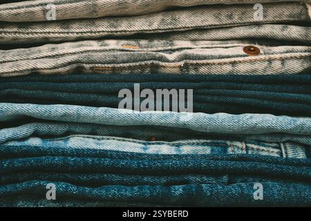 Stack of folded denim pants. Fashion, style, stock and store concept. Stock Photo