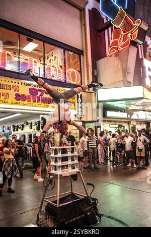 Street performer balancing on glasses, Freemont Street Experience Light Show, Las Vegas, Nevada, USA, North America Stock Photo
