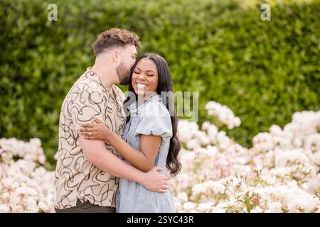 Man giving woman a kiss on her cheek Stock Photo