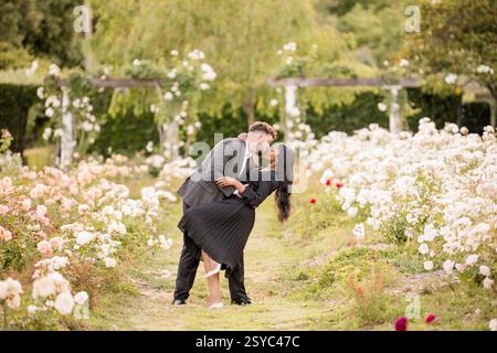 Romantic couple sharing a kiss during a dip Stock Photo
