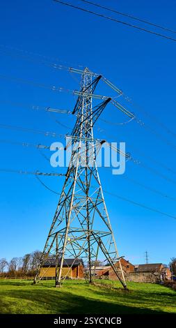 Electricity pylon in farm field in the countryside,UK Stock Photo