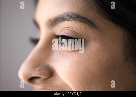 Close-up profile view of young Indian woman face Stock Photo