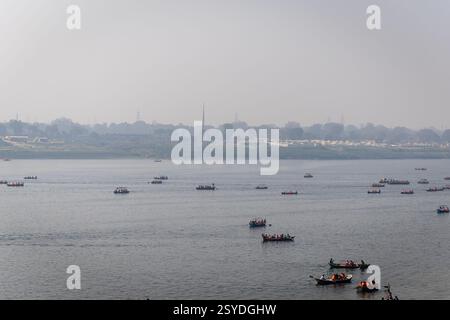 pilgrims on boat crossing sacred ganges river for triveni sangam at ...
