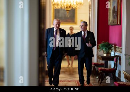 Washington, United States. 27th Feb, 2025. U.S President Donald Trump, left, walks with British Prime Minister Sir Keir Starmer, right, on the way to the East Room of the White House, February 27, 2025 in Washington, DC Credit: Daniel Torok/White House Photo/Alamy Live News Stock Photo