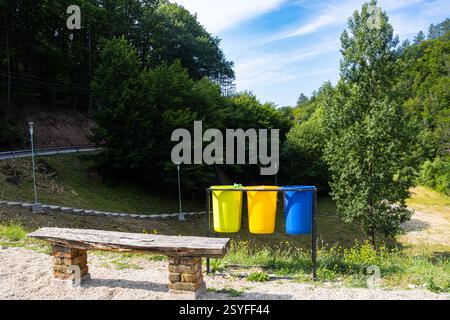 Wooden bench at a resting spot on the side of the road in the Apuseni Mountains, Bihor County, Romania Stock Photo
