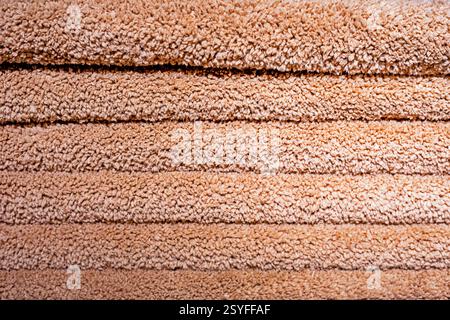 beige, red, green towels with a large background Stock Photo