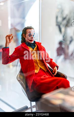 Bangkok Thailand - February 20, 2025: Figure model Joker character of Batman the dark knight from DC movies,  Sitting in the barber chair in front of Stock Photo