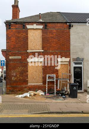 Derelict empty boarded-up house, Willingham Terrace, Grimsby, north east Lincolnshire, England, UK Stock Photo