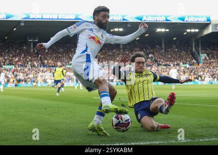 Jayden Bogle of Leeds United battles with Femi Azeez of Millwall during ...