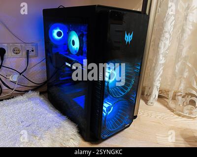 Kyiv, Ukraine - February 27, 2025: Gaming desktop Acer Predator Orion 5000 setup with blue LED lights, showcasing advanced components and cooling. Stock Photo