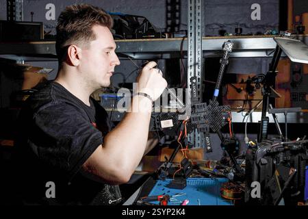 Donetsk Region, Ukraine. 18th Jan, 2025. An engineer works meticulously on assembling a drone in the workshop. Engineers of the 93rd Mechanized Brigade are seen working in a drone workshop assembling and repairing critical electronic components. As modern warfare evolves, drones play an increasingly vital role enhancing reconnaissance, strike capabilities and battlefield efficiency. Their expertise directly contributes to Ukraine's defense efforts. (Credit Image: © Mykhaylo Palinchak/SOPA Images via ZUMA Press Wire) EDITORIAL USAGE ONLY! Not for Commercial USAGE! Stock Photo