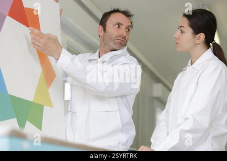 female apprentice painter on training course Stock Photo