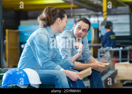 colleagues in warehouse having a break Stock Photo