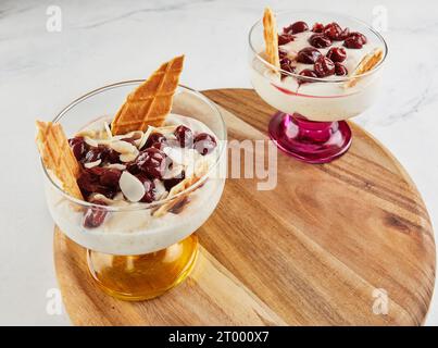 Cherries delicacy white cheese biscuits almond chips. Stock Photo