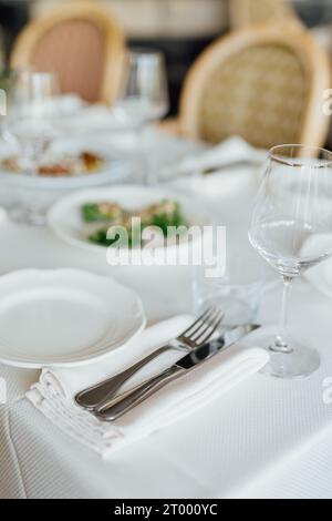 Luxury table settings for fine dining in romantic LUXURY Restaurant.  For events, weddings and celebration. Stock Photo