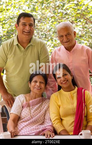 Portrait of happy Indian family at home Stock Photo