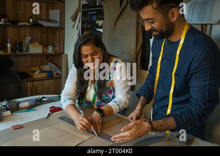 Fashion designers working on patterns in their studio Stock Photo